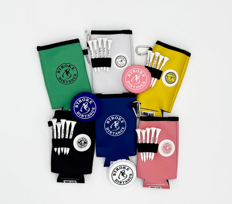 Collection of golf accessories including tees, bags, and a can cooler with 'Stroke Distance' branding on a white background.